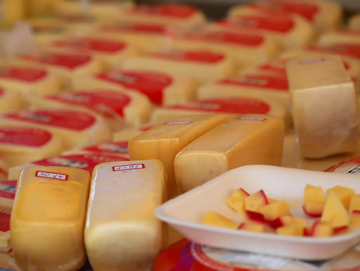 A cheese display at a market
